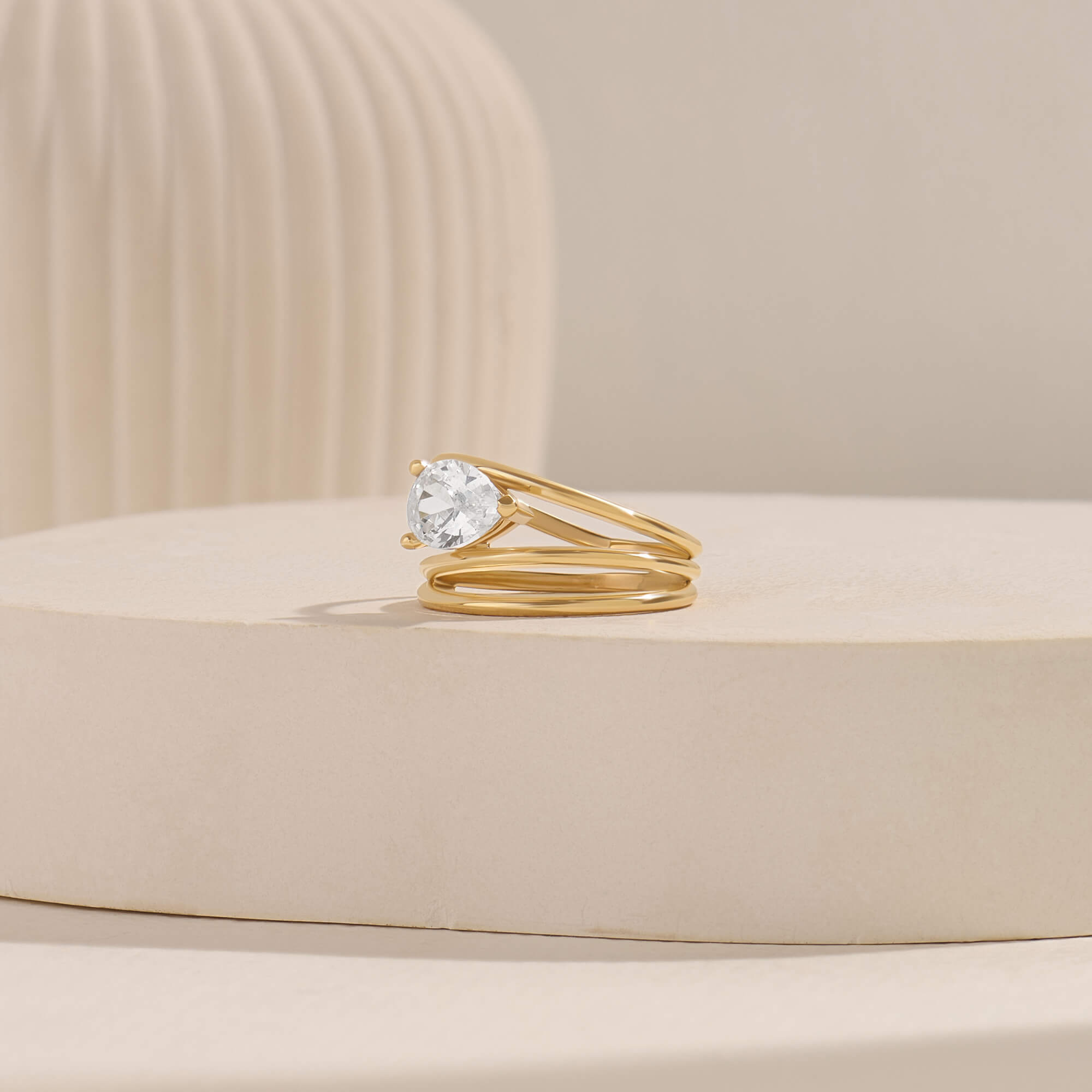 Pear Moissanite Solitaire Spiral Ring in Yellow Gold