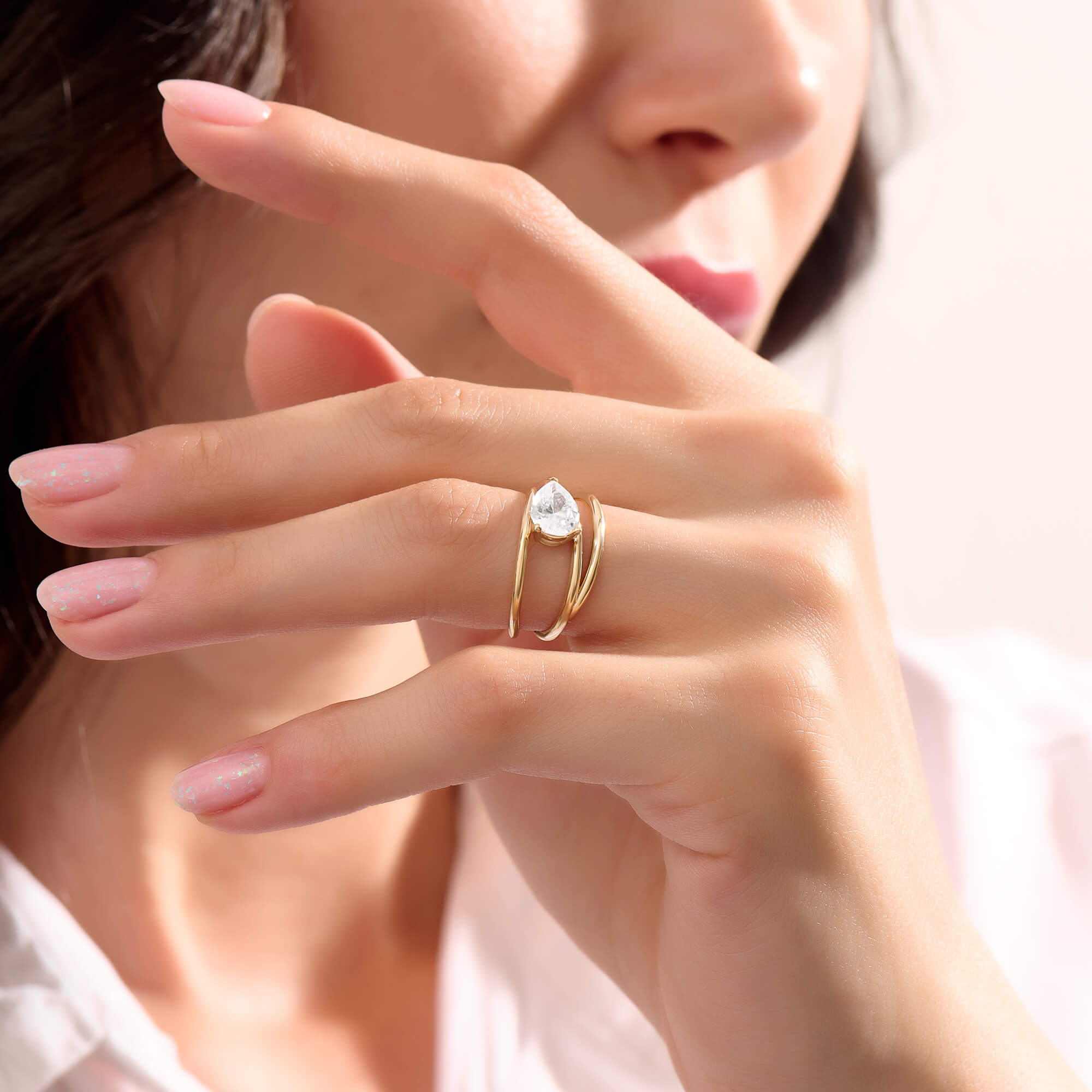 Women's Pear Moissanite Solitaire Spiral Ring in Yellow Gold