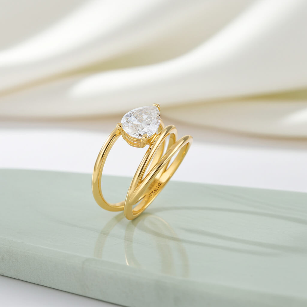 Pear Moissanite Spiral Solitaire Ring in Yellow Solid Gold
