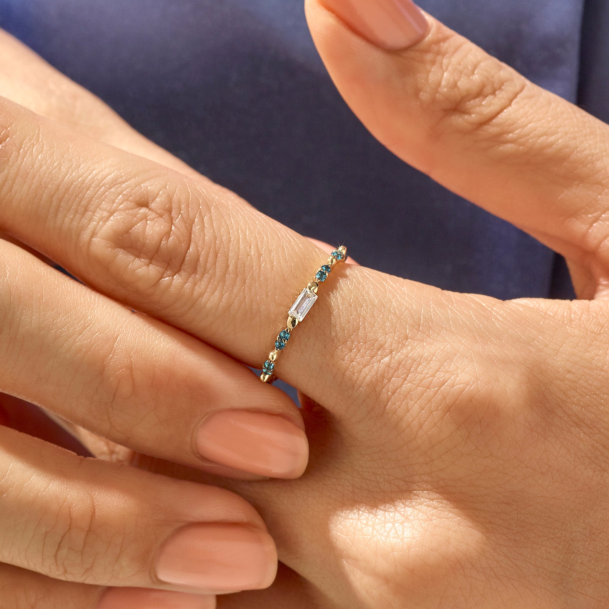 Novella Ring with Blue Stones and Baguette Cut CZ