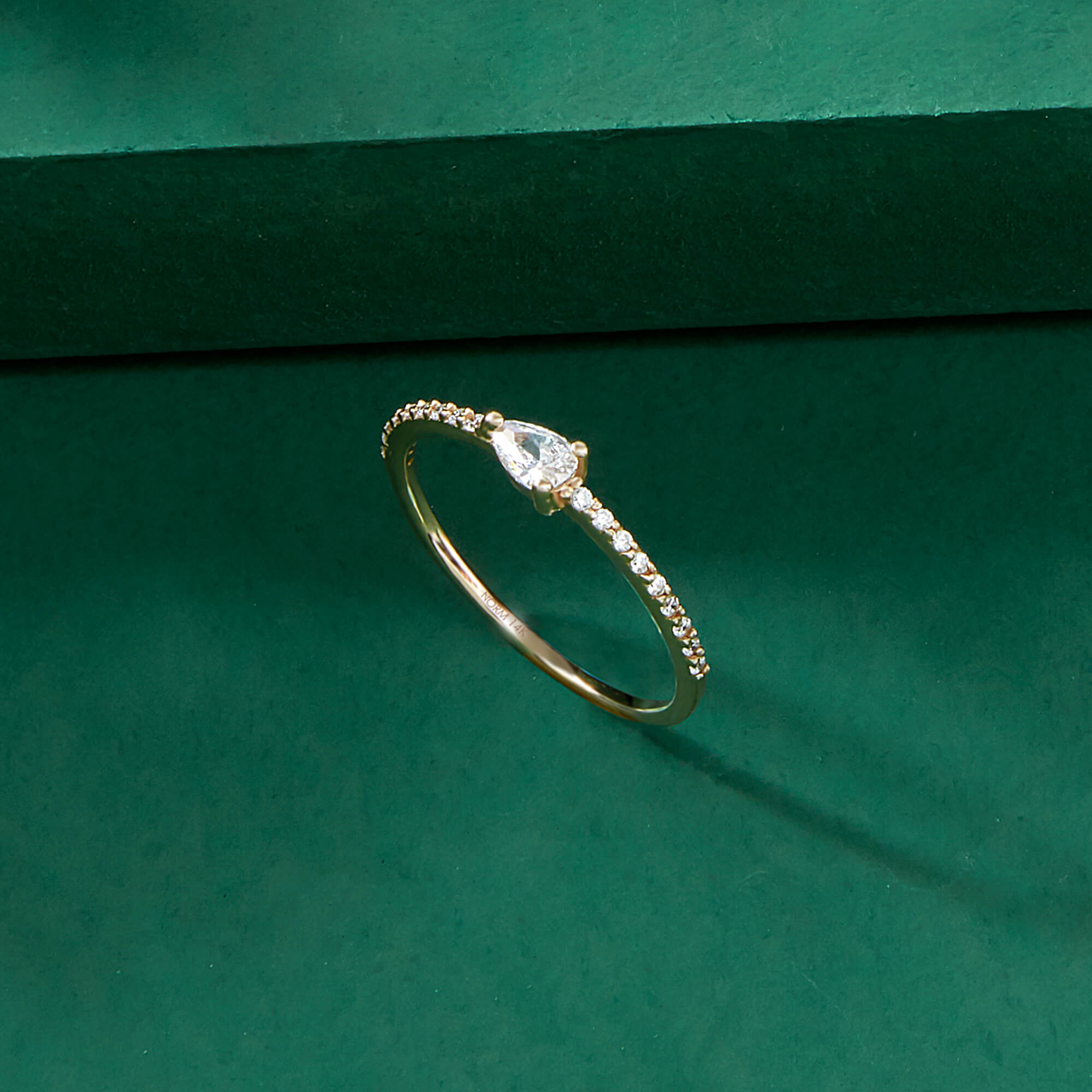 Minimalist Half Eternity Pear Ring in Gold