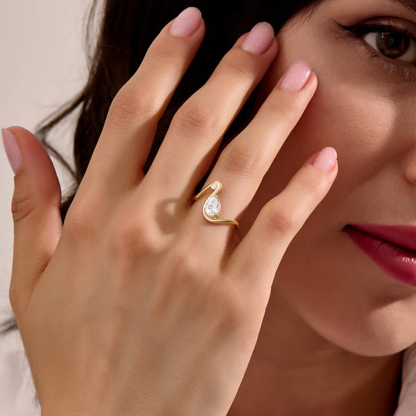 Women's Moissanite Pear Solitaire Swirl Ring in Solid Gold