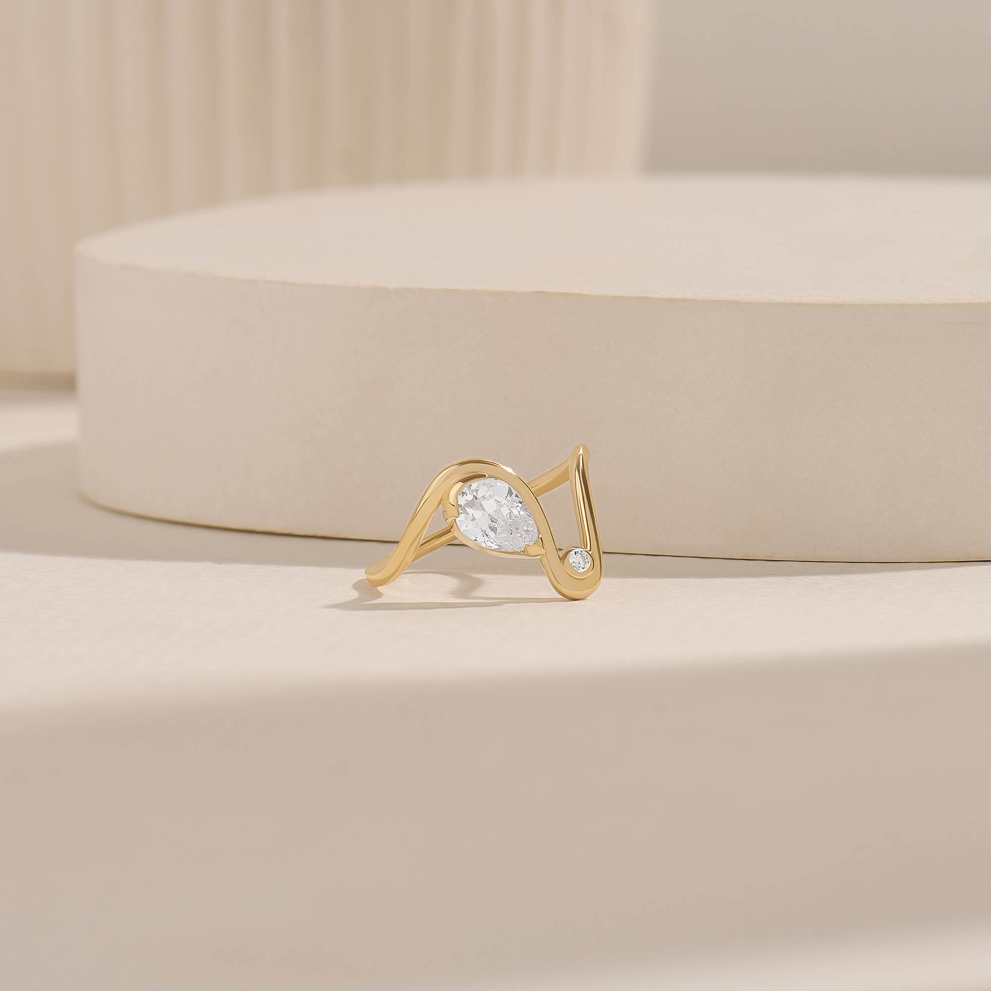Pear Solitaire Swirl Ring with Moissanite Stones in Solid Gold