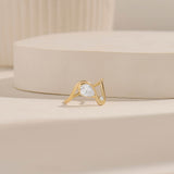Pear Solitaire Swirl Ring with Moissanite Stones in Solid Gold