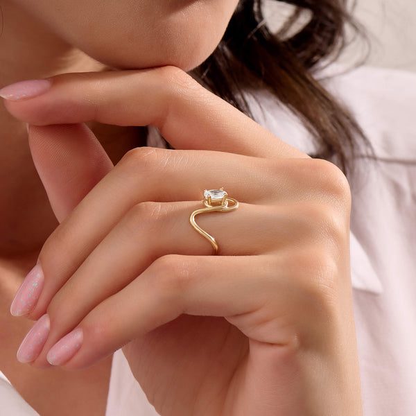 Women's Oval Moissanite Solitaire Swirl Ring in Solid Gold