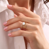 Women's Pear Moissanite Solitaire Spiral Ring in Solid Gold