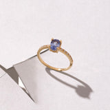Tanzanite Oval Ring Paved with CZ in Gold