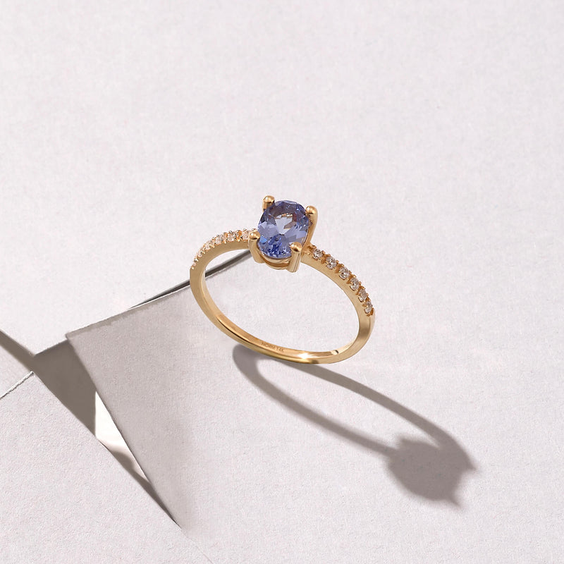 Tanzanite Oval Ring Paved with CZ in Gold